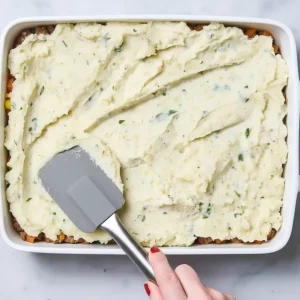 Top with mashed potatoes